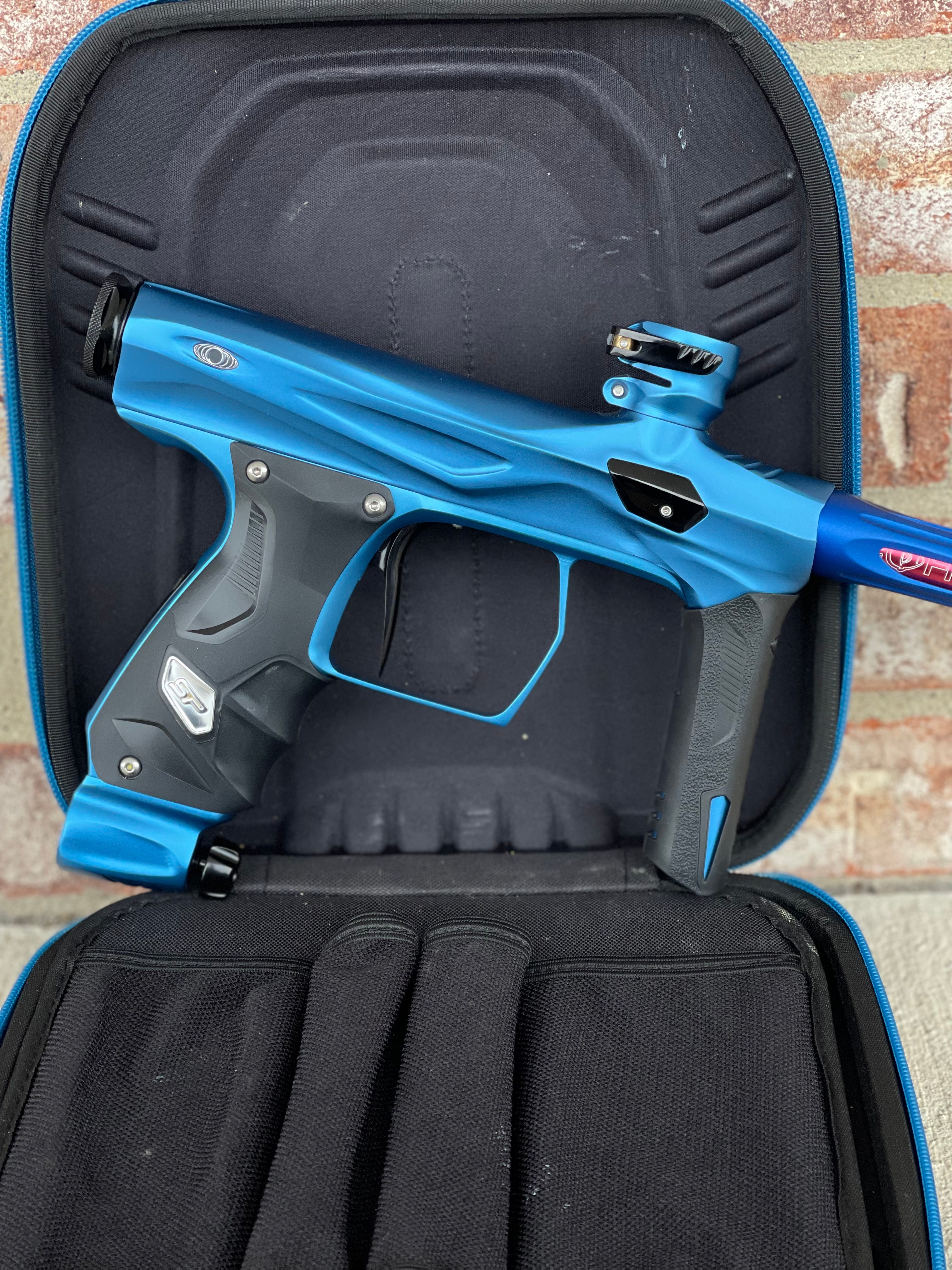 Used Shocker AMP Paintball Gun - Dust Blue w/Deep Blue Freak XL Back