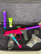 Used Dye M2 Paintball Gun - Pink/Purple/Black/Gold (Spray Paint Collage)