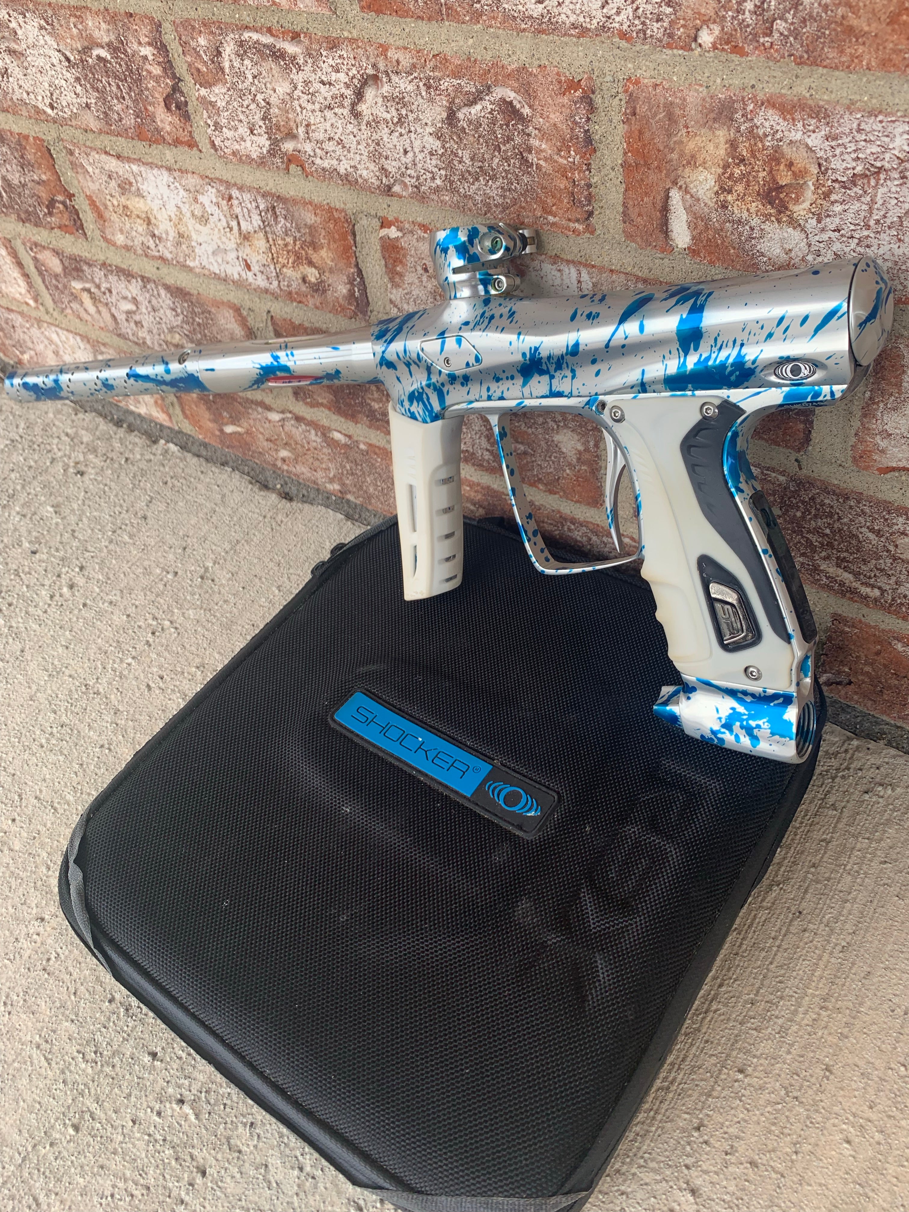 Used Shocker RSX Paintball Marker - Silver/Blue Splash