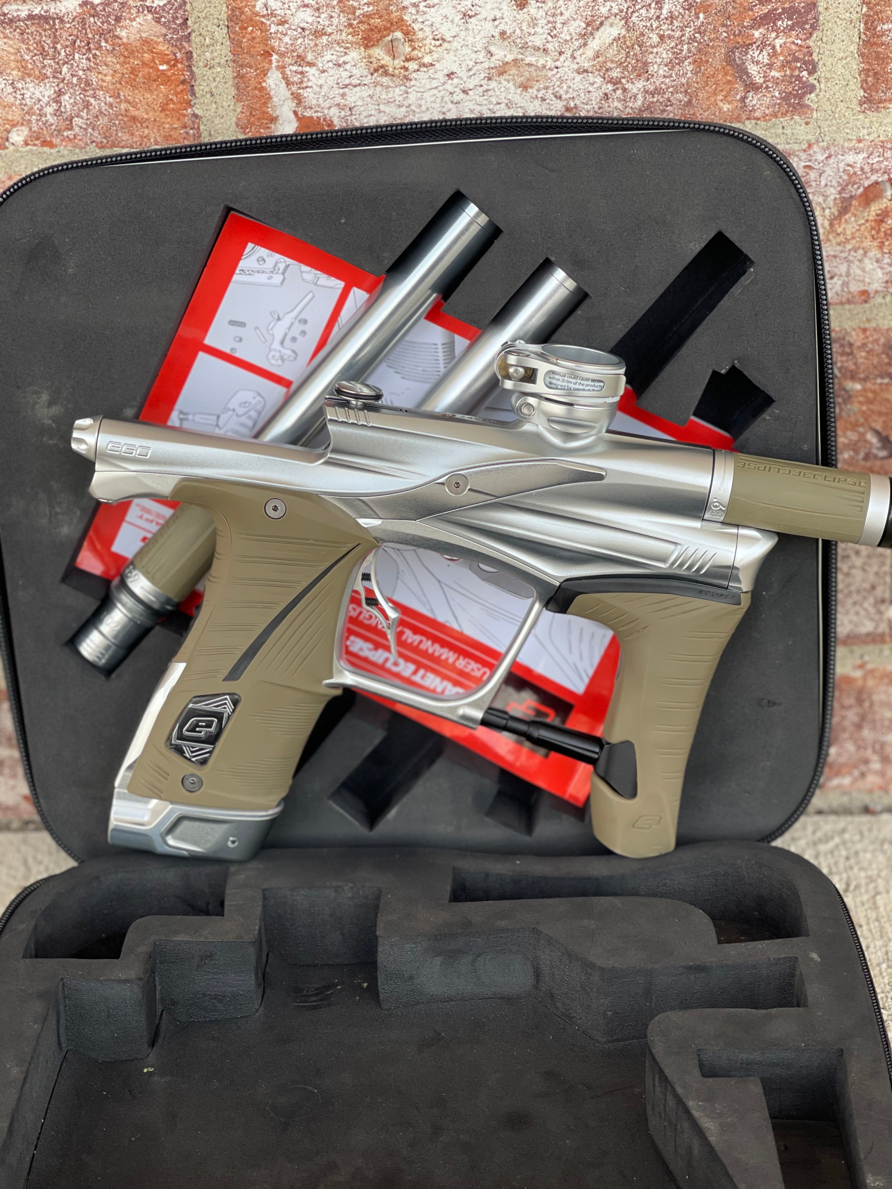 Used Planet Eclipse LV1.6 Paintball Gun - Silver (Pure) w/ Tan Grips, 3 FL Inserts, and Infamous Deuce Trigger