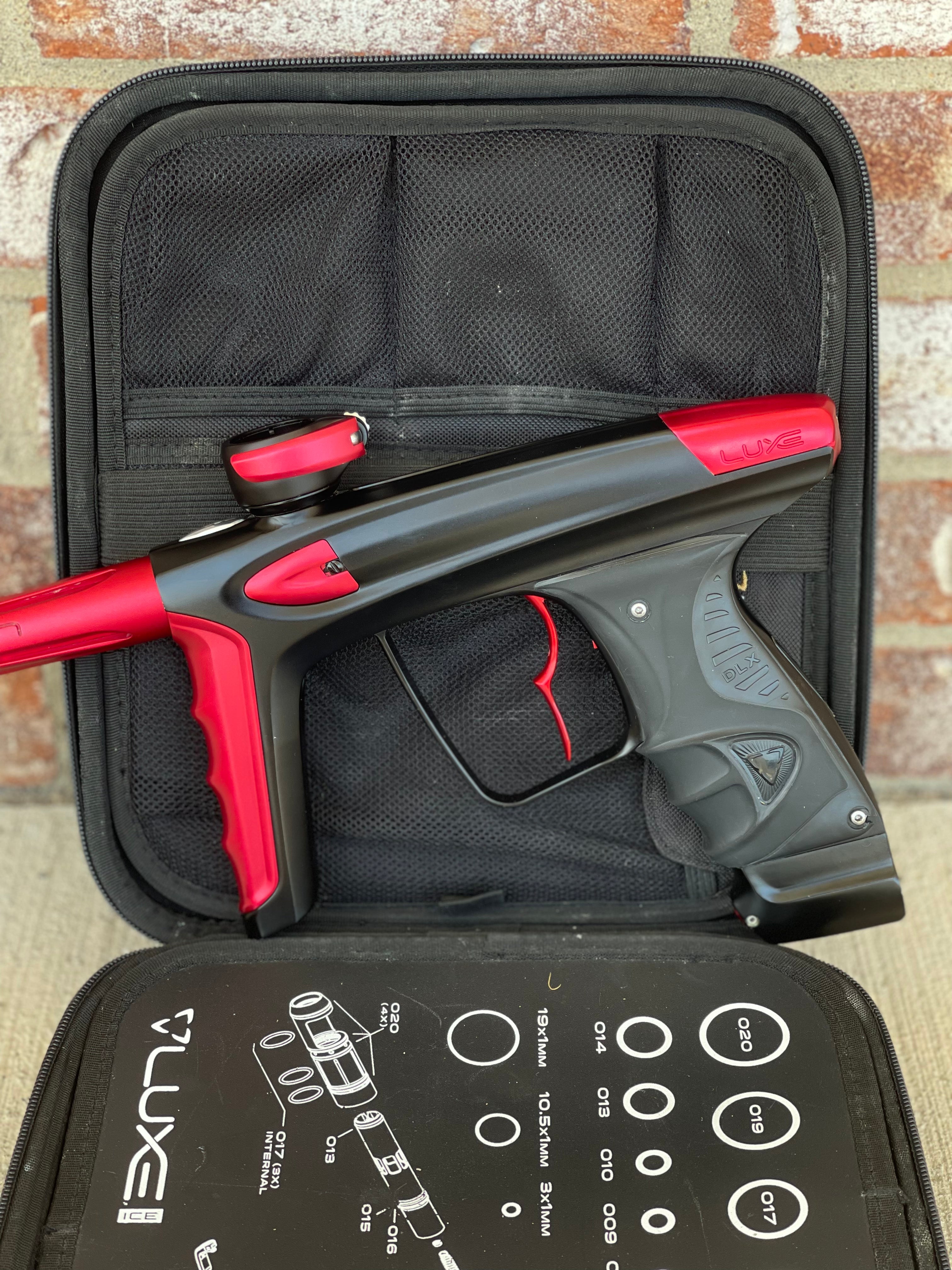 Used DLX Luxe Ice Paintball Gun - Dust Black / Dust Red w/ Infamous Deuce Trigger and 3 Freak Inserts