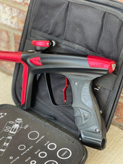 Used DLX Luxe Ice Paintball Gun - Dust Black / Dust Red w/ Infamous Deuce Trigger and 3 Freak Inserts