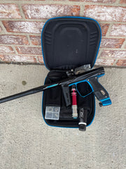 Used Shocker XLS Paintball Gun - Dust Black w/ Blue Trigger Frame