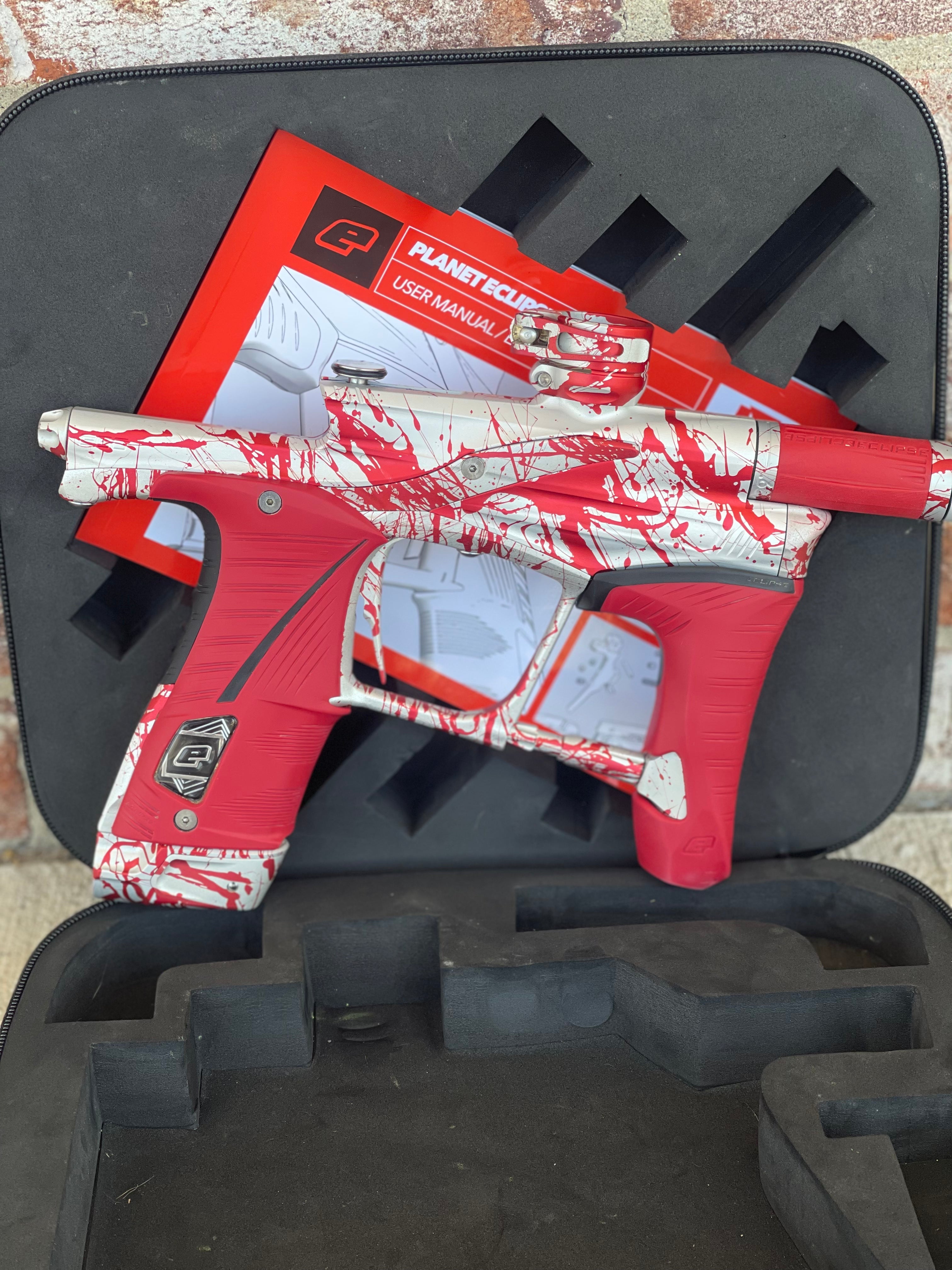 Used Planet Eclipse LV1.6 Paintball Gun - Silver / Red Splash *Custom Anno* w/ Infamous Silencio Tip