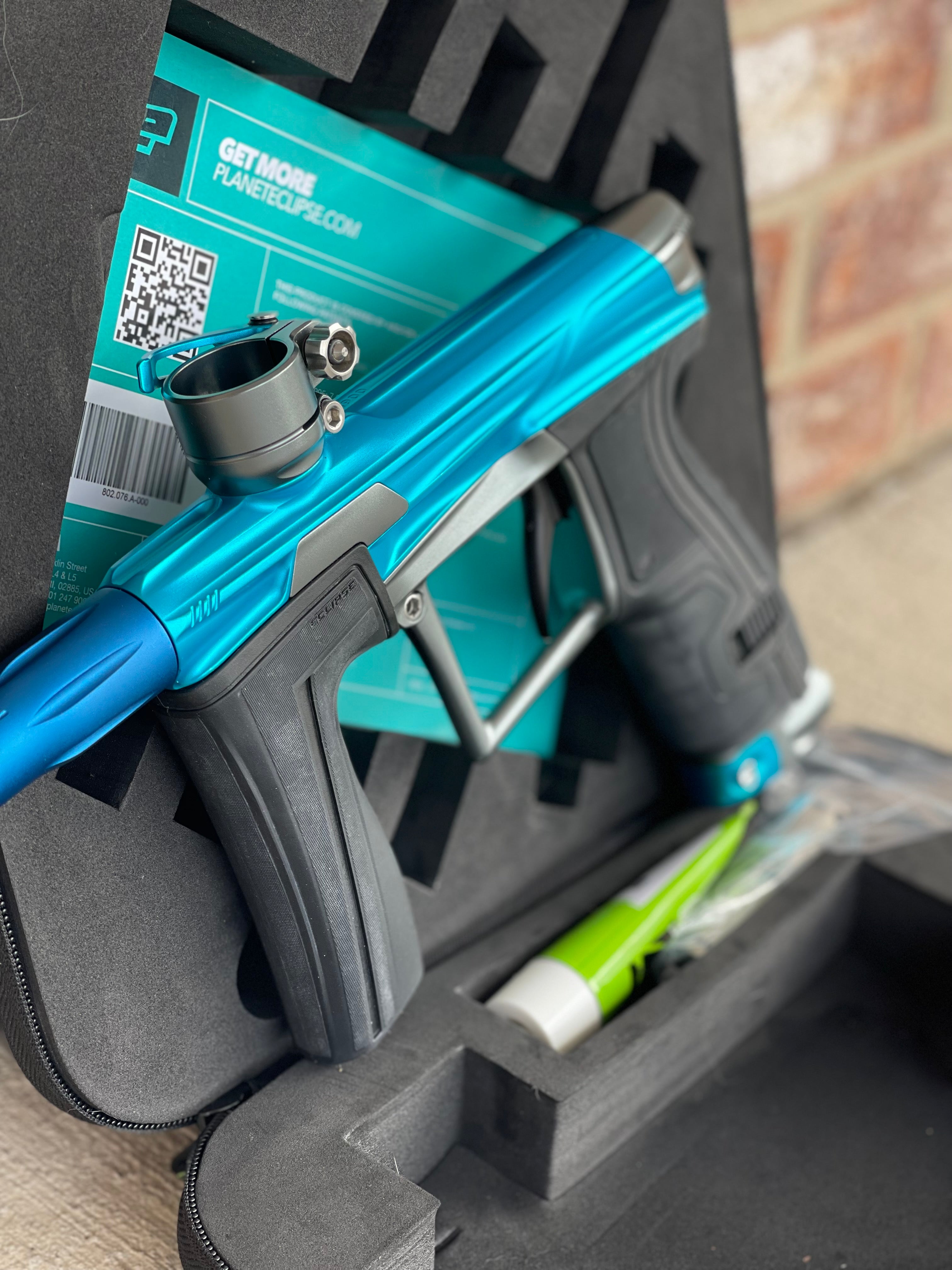 Used Planet Eclipse Geo 4 Paintball Gun - Teal/Grey w/ SSC Trigger with Dye UL Barrel System