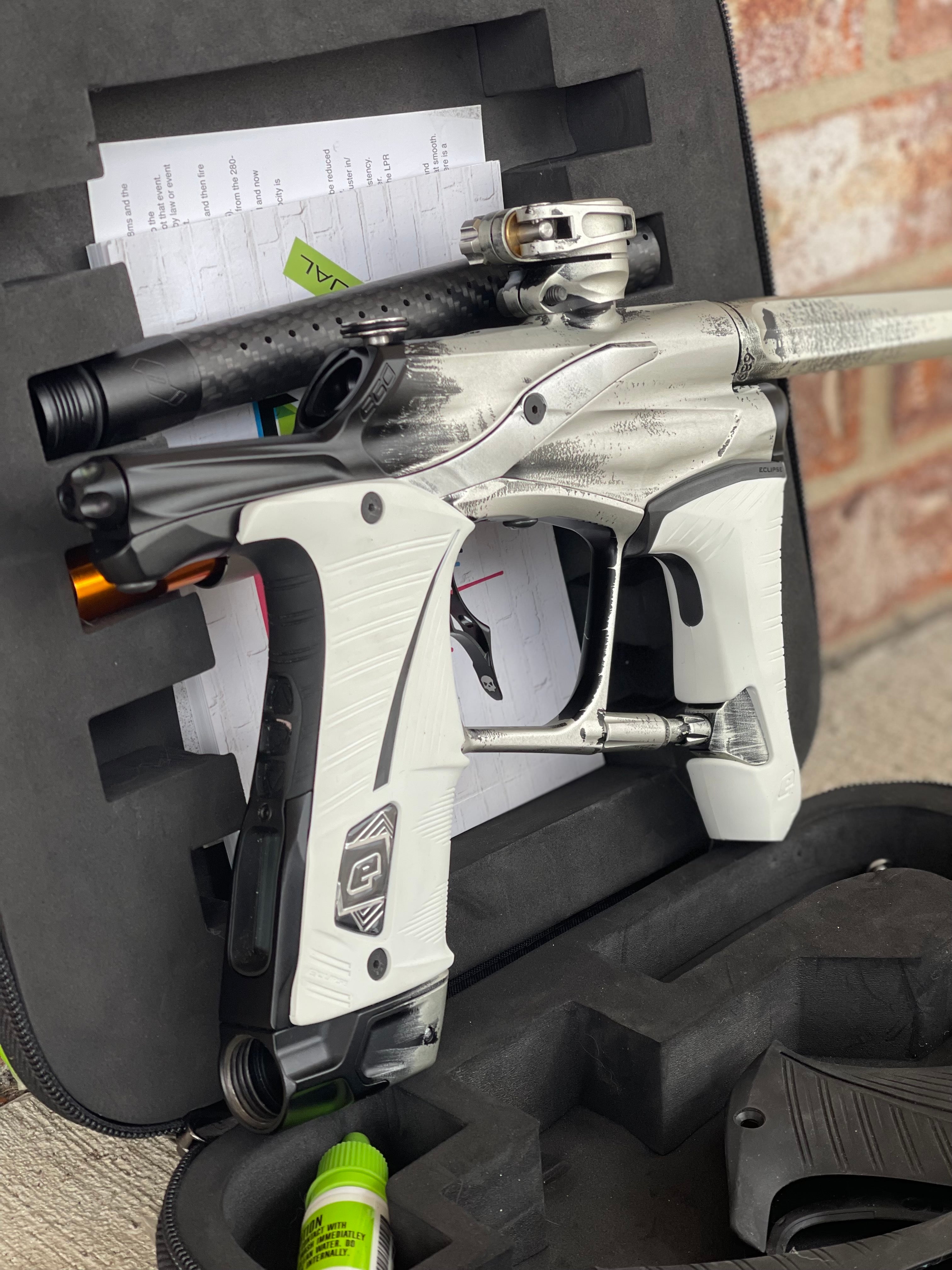 Used Planet Eclipse Ego Lv1.5 Paintball Marker- Silver/Black Fade Custom Anno w/ Infamous Deuce Trigger, White & Black Grips, Freak Barrel & Stock Barrel