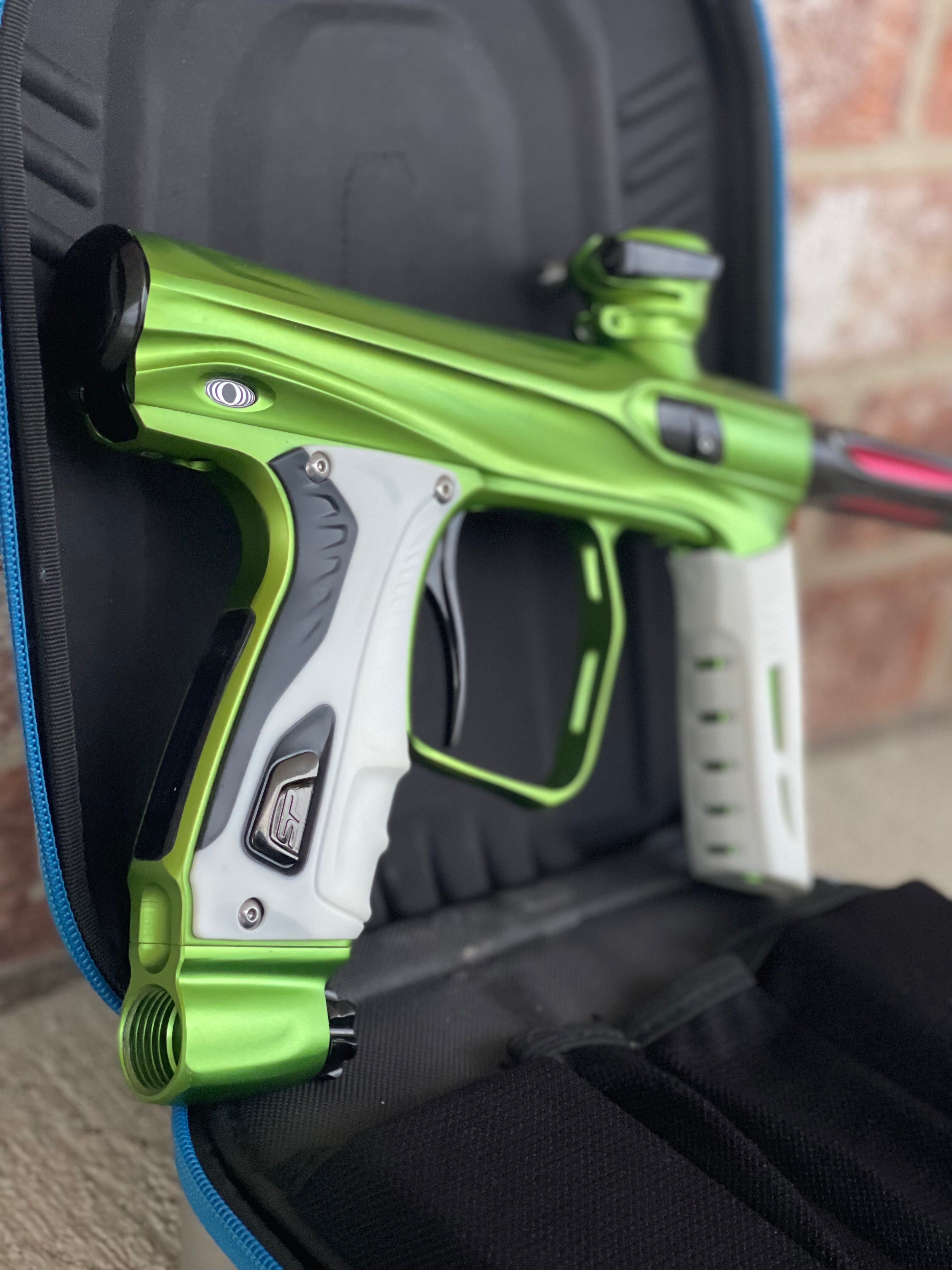 Used Shocker XLS Paintball Marker- Green w/ Extra Inserts and White Grips