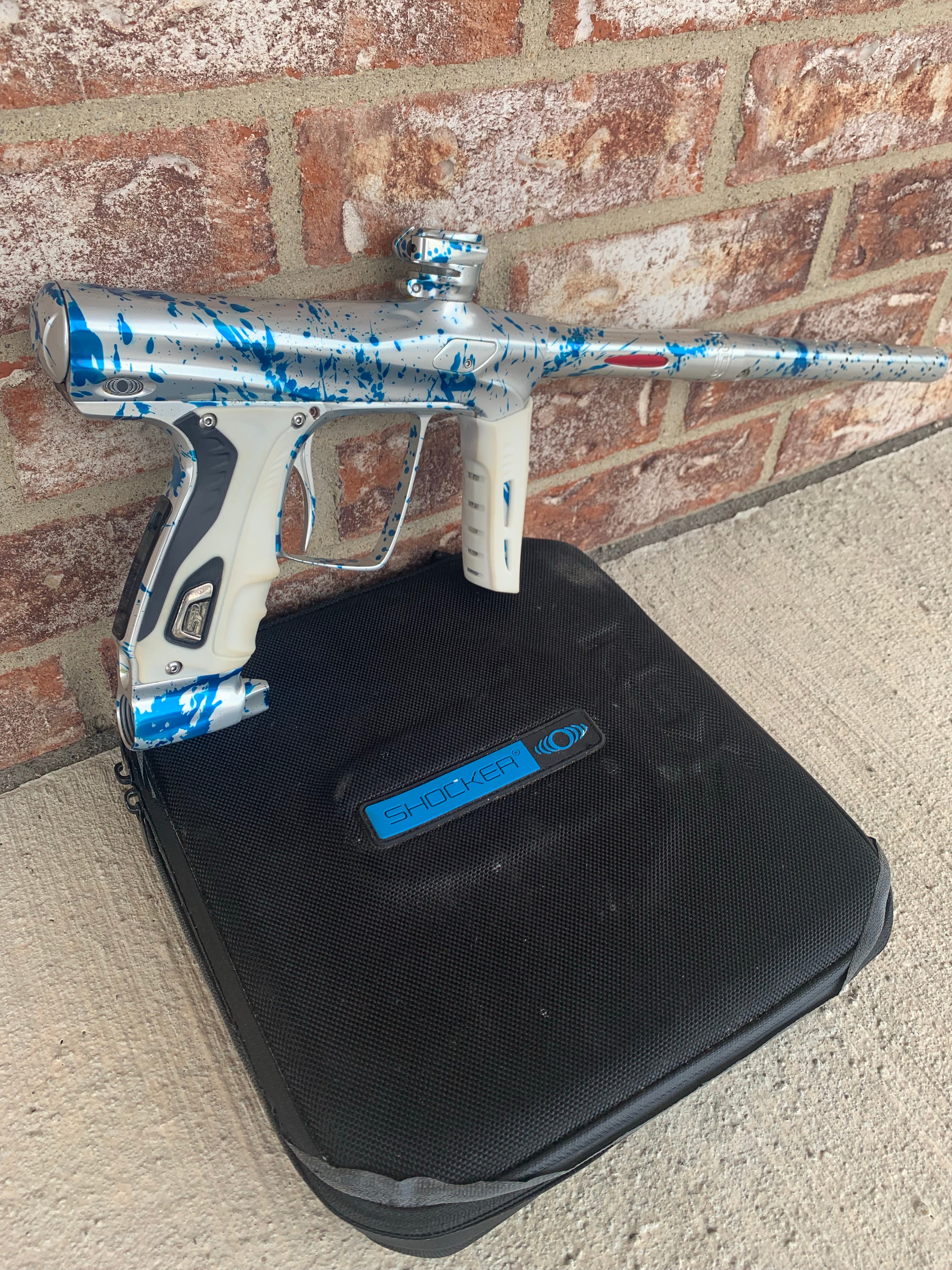 Used Shocker RSX Paintball Marker - Silver/Blue Splash