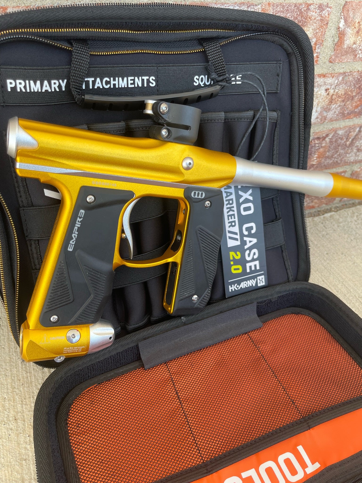 Used Empire Mini GS Paintball Gun w/ 2 Piece Barrel - Dust Gold / Silver w/ HK Army Exo 2.0 Marker Case