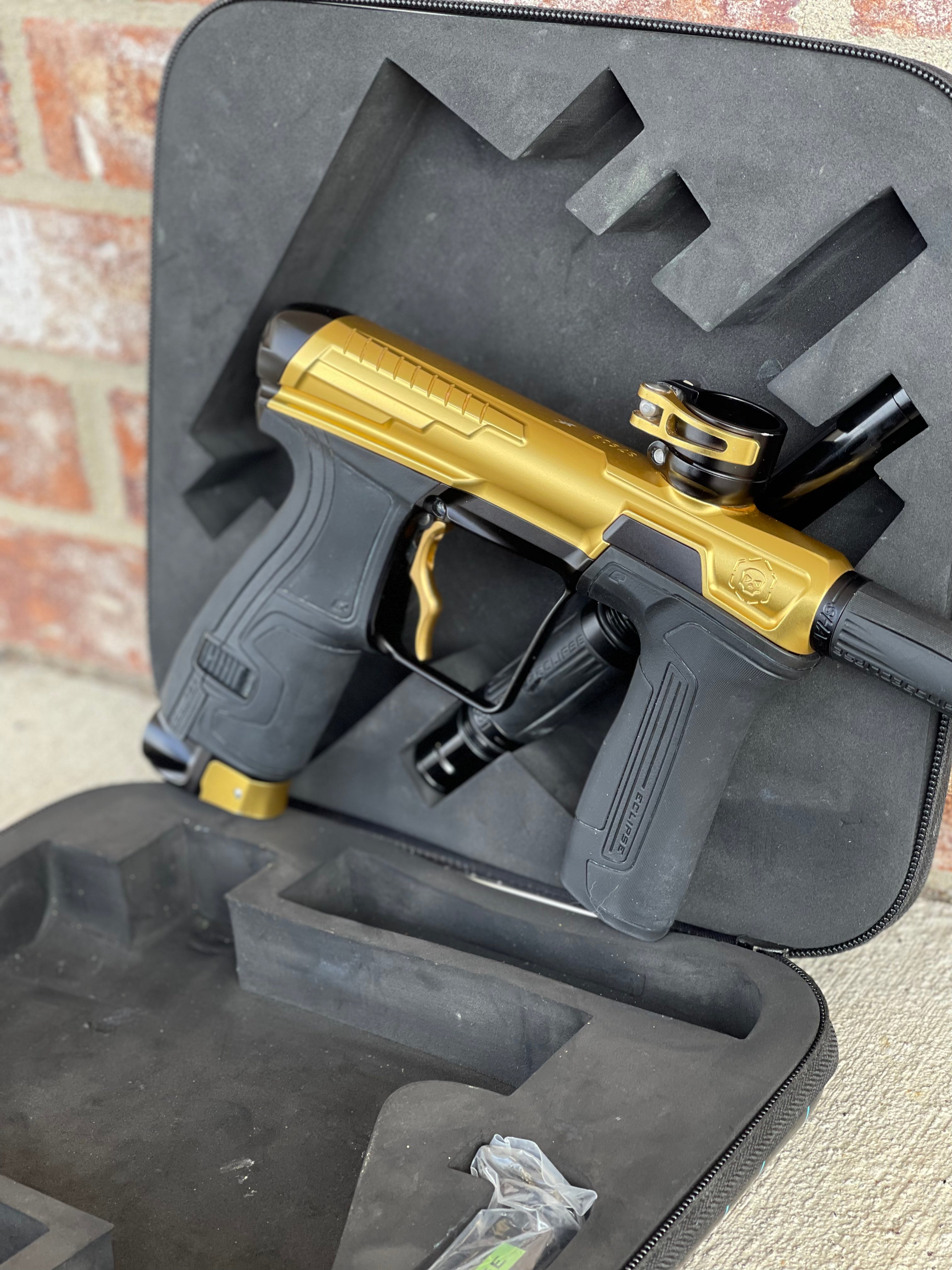 Used Infamous / Planet Eclipse CS2 Paintball Gun - Gold / Black w/ Deuce Trigger & 2 FL Inserts