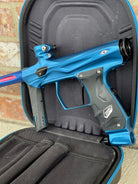 Used Shocker AMP Paintball Gun - Dust Blue w/Deep Blue Freak XL Back