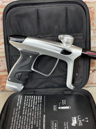 Used DLX Luxe TM40 Paintball Gun - Dust Silver/Gloss Black w/ Stock Bolt and SSC Bolt