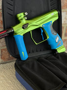 Used Shocker Amp Paintball Gun - Green/Black with Infamous Deuce Trigger and Blue Grips