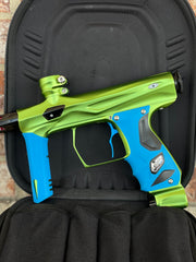 Used Shocker Amp Paintball Gun - Green/Black with Infamous Deuce Trigger and Blue Grips