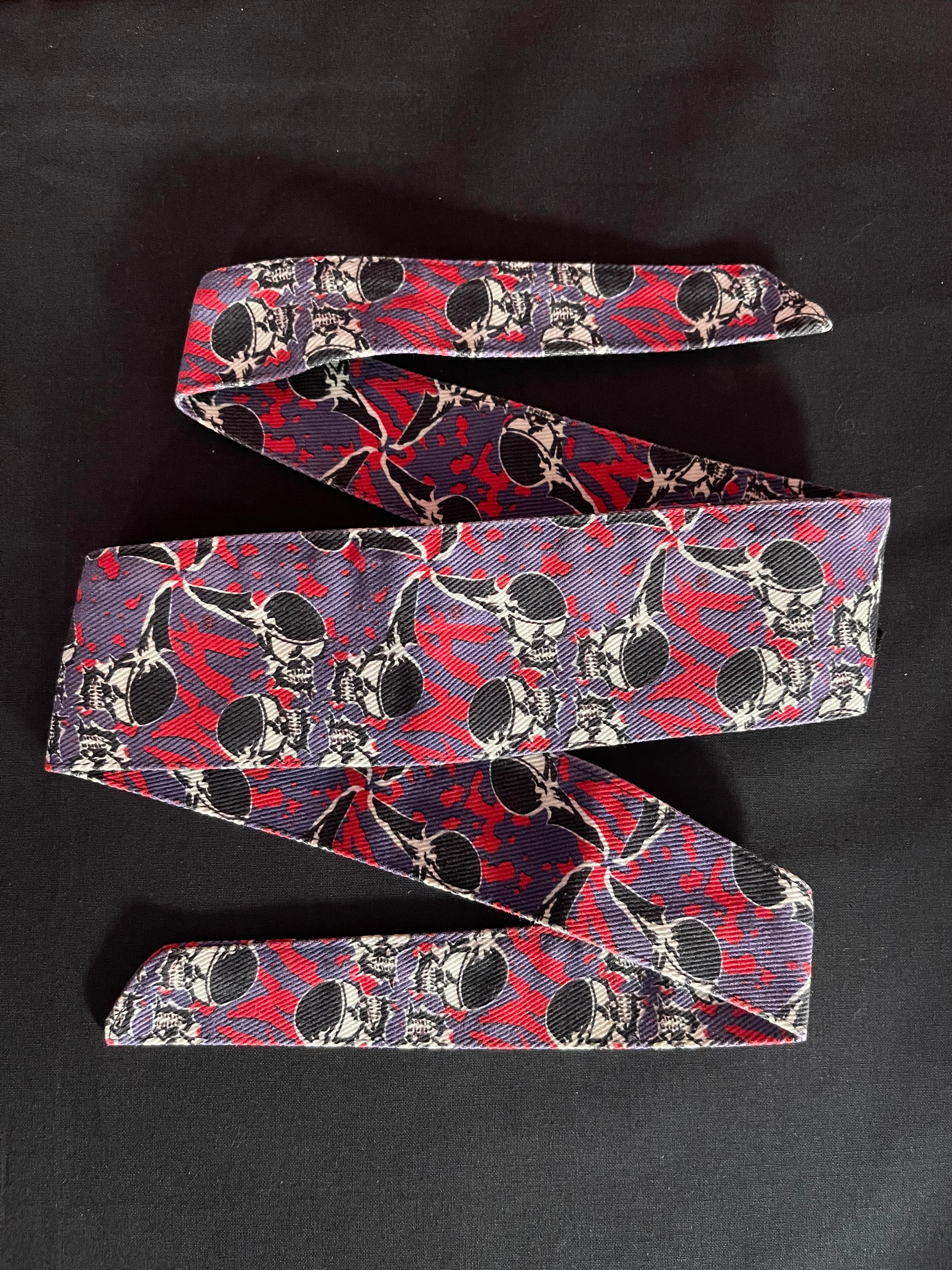 Used Sandana Flying Skulls Headband - Purple/Pink w/ Olive Tag