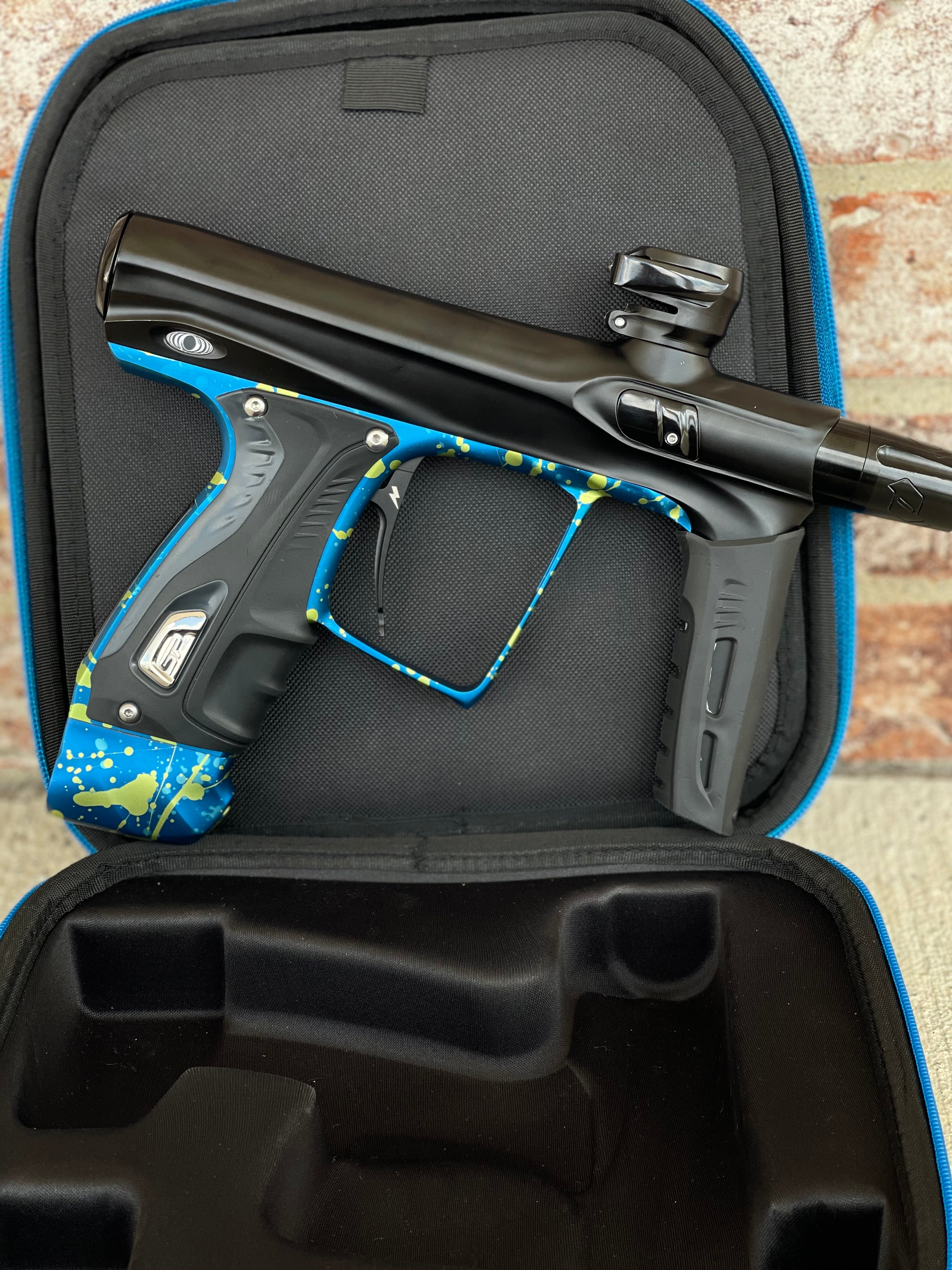 Used Shocker XLS Paintball Gun - Black with Blue Green Splash Trigger Frame and CVO Frame