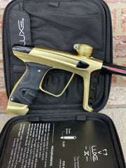 Used DLX Luxe X Paintball Gun - Dust Gold / Polished Black