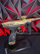 Used Dye M3+ Paintball Gun - 007 Polished Gold w/ Charging Pad