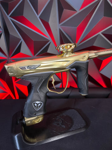 Used Dye M3+ Paintball Gun - 007 Polished Gold w/ Charging Pad