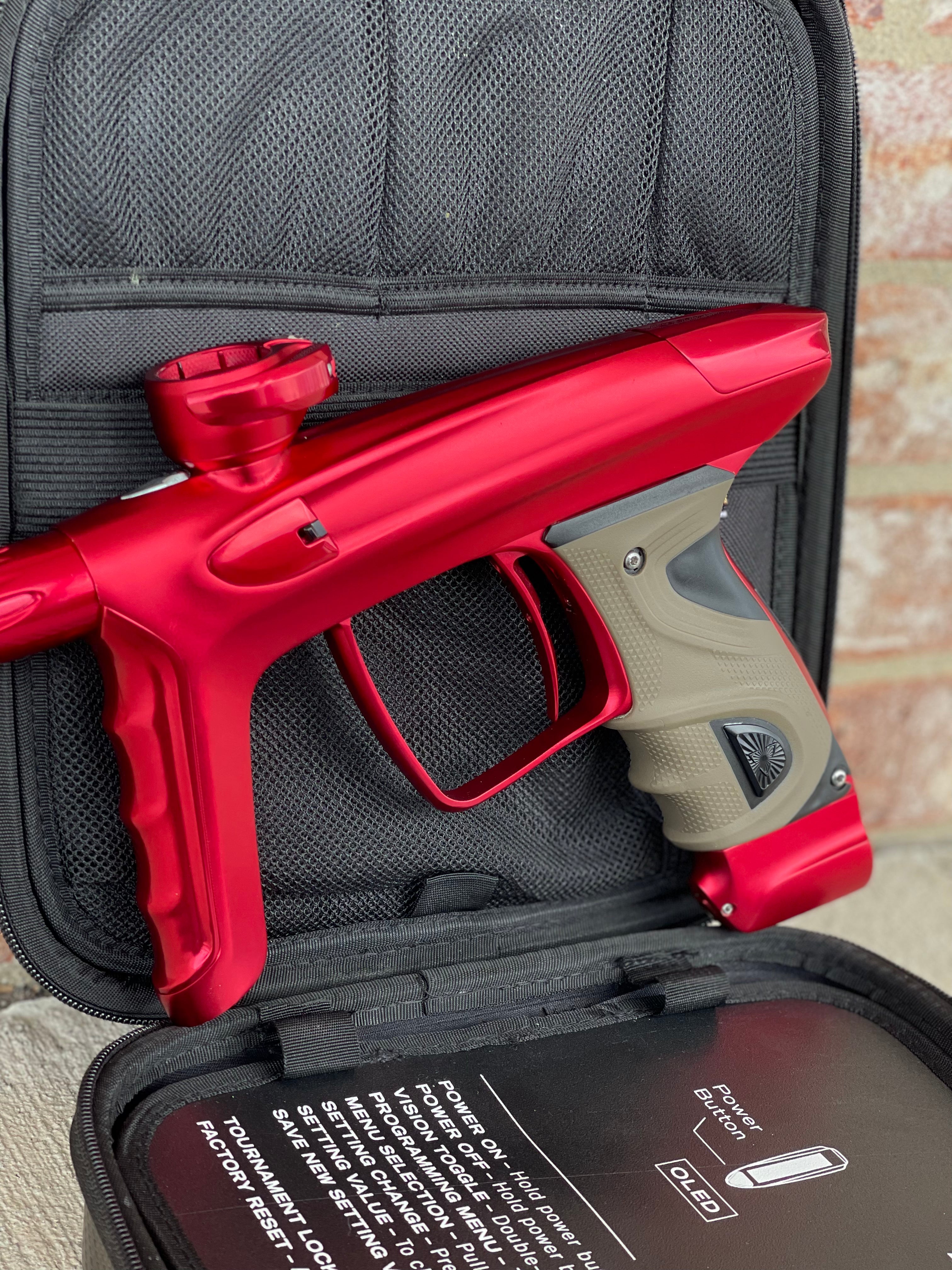 Used DLX Luxe TM40 Paintball Gun - Dust Red / Gloss Red w/ 2 back grips and SSC Soft Tip Bolt