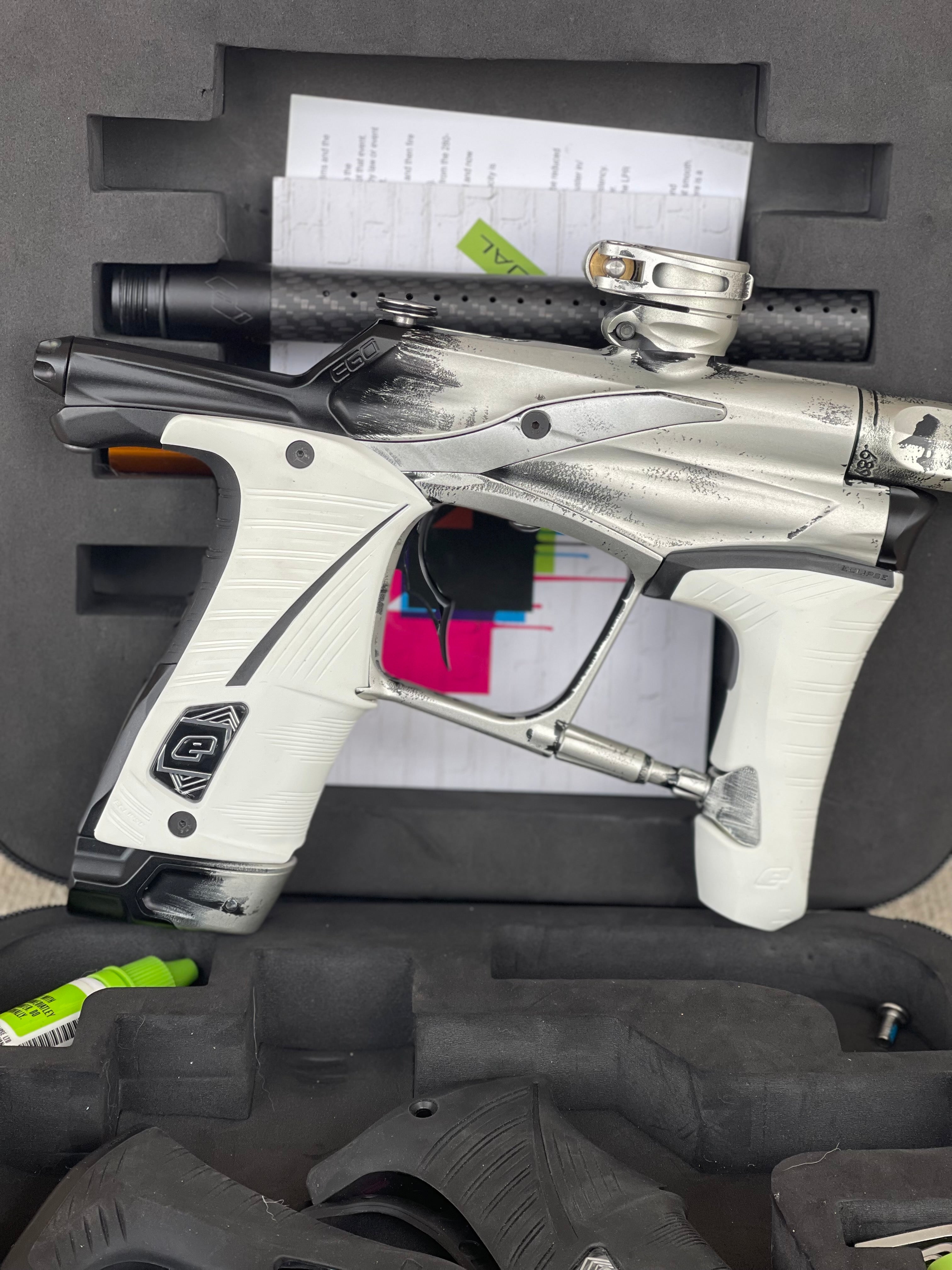 Used Planet Eclipse Ego Lv1.5 Paintball Marker- Silver/Black Fade Custom Anno w/ Infamous Deuce Trigger, White & Black Grips, Freak Barrel & Stock Barrel