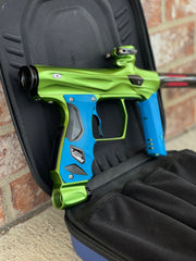 Used Shocker Amp Paintball Gun - Green/Black with Infamous Deuce Trigger and Blue Grips