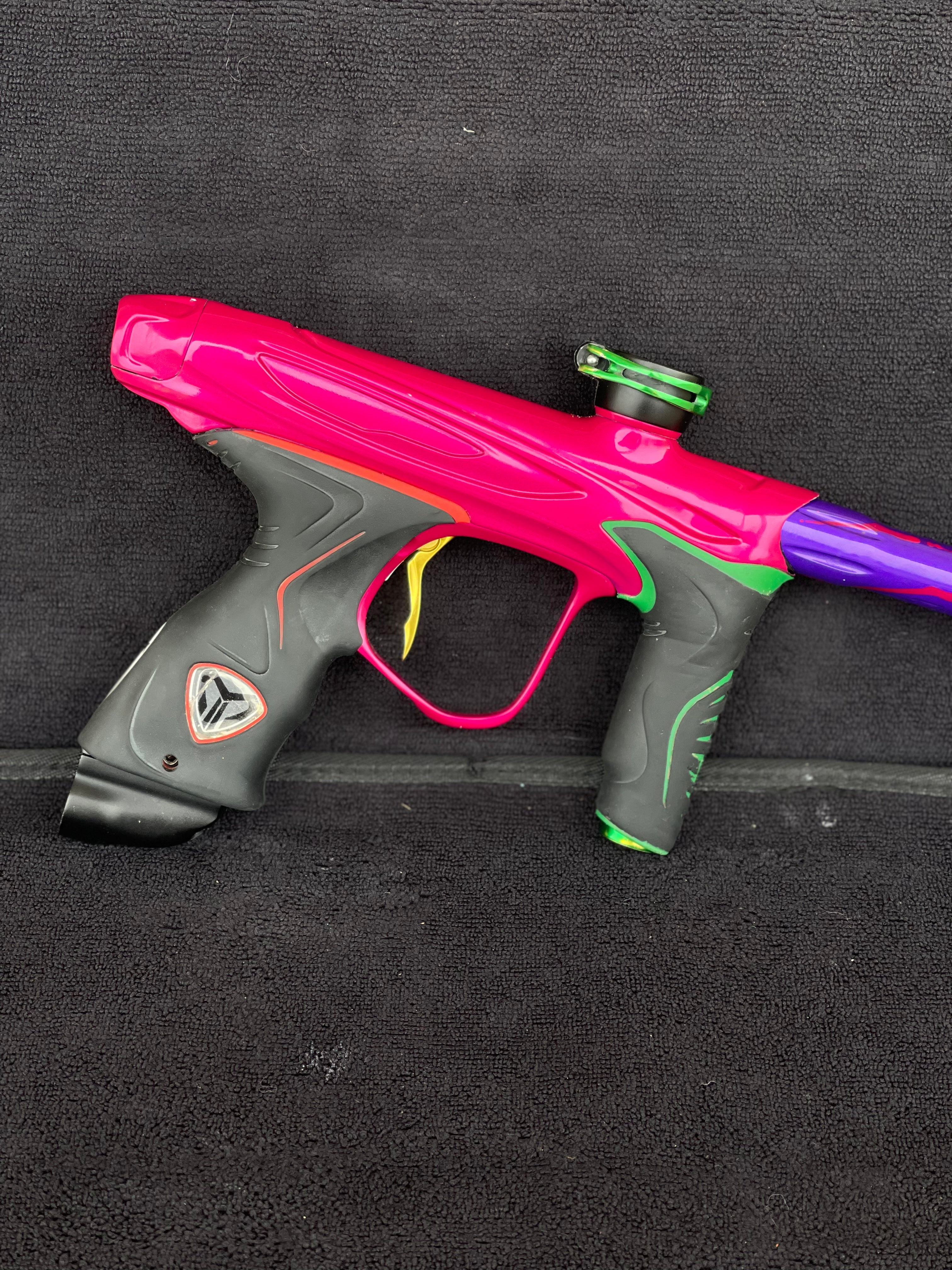 Used Dye M2 Paintball Gun - Pink/Purple/Black/Gold (Spray Paint Collage)