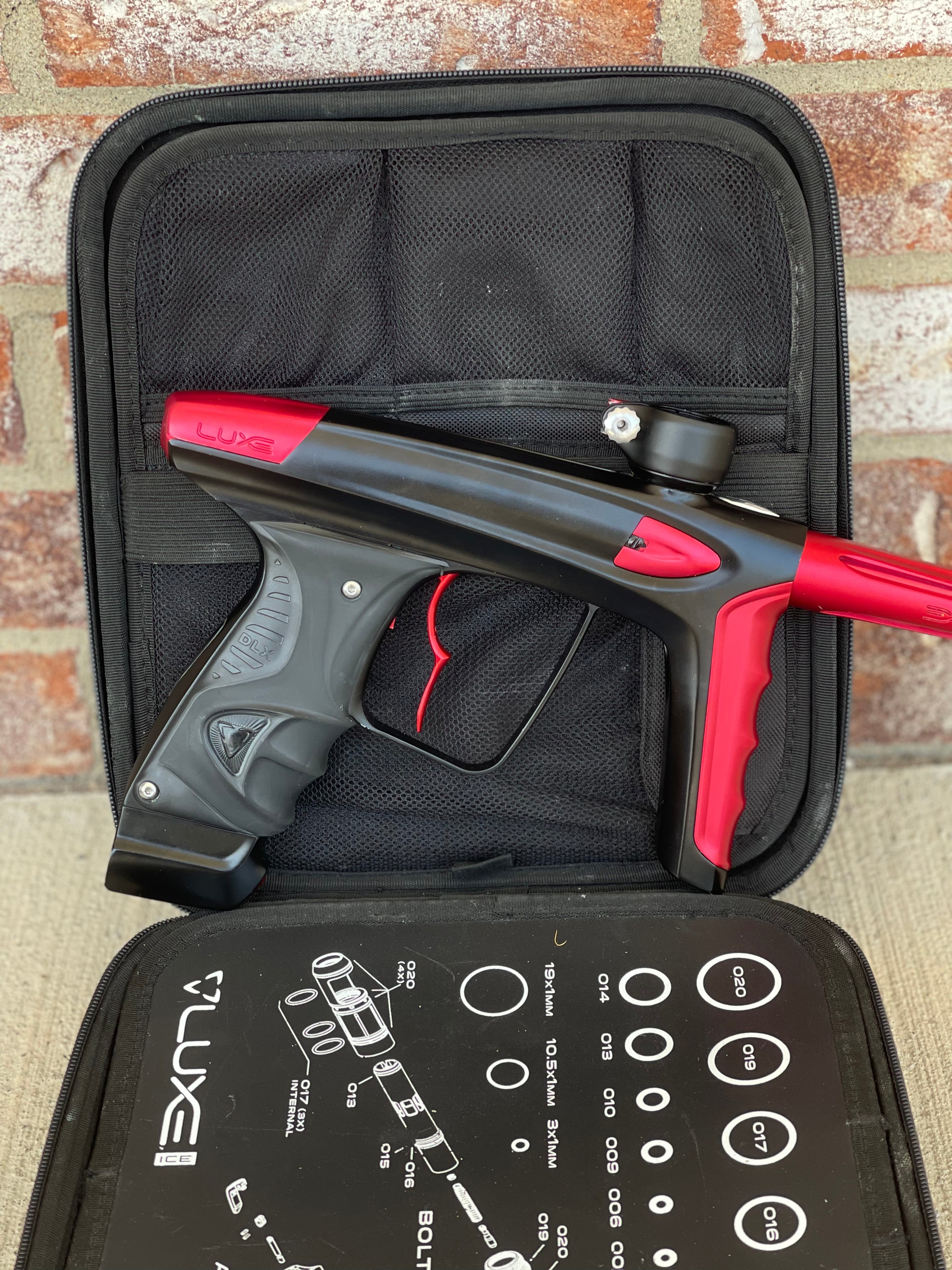 Used DLX Luxe Ice Paintball Gun - Dust Black / Dust Red w/ Infamous Deuce Trigger and 3 Freak Inserts