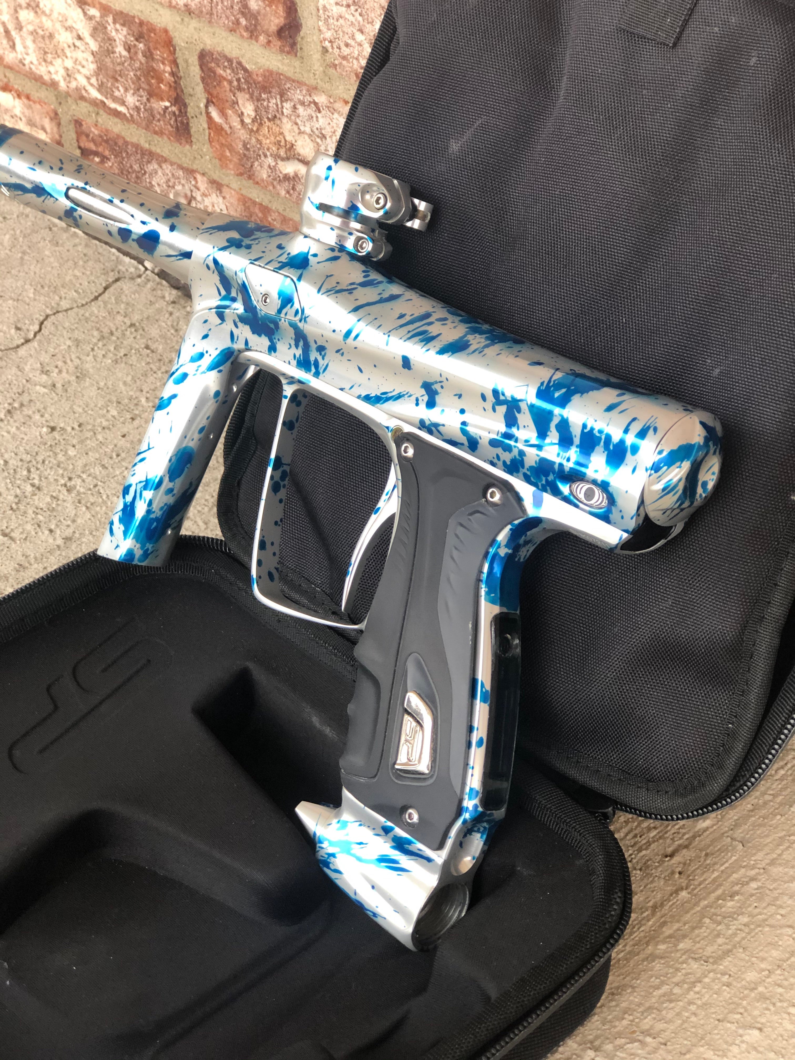 Used SP Shocker RSX Paintball Gun - Silver/Blue Splash