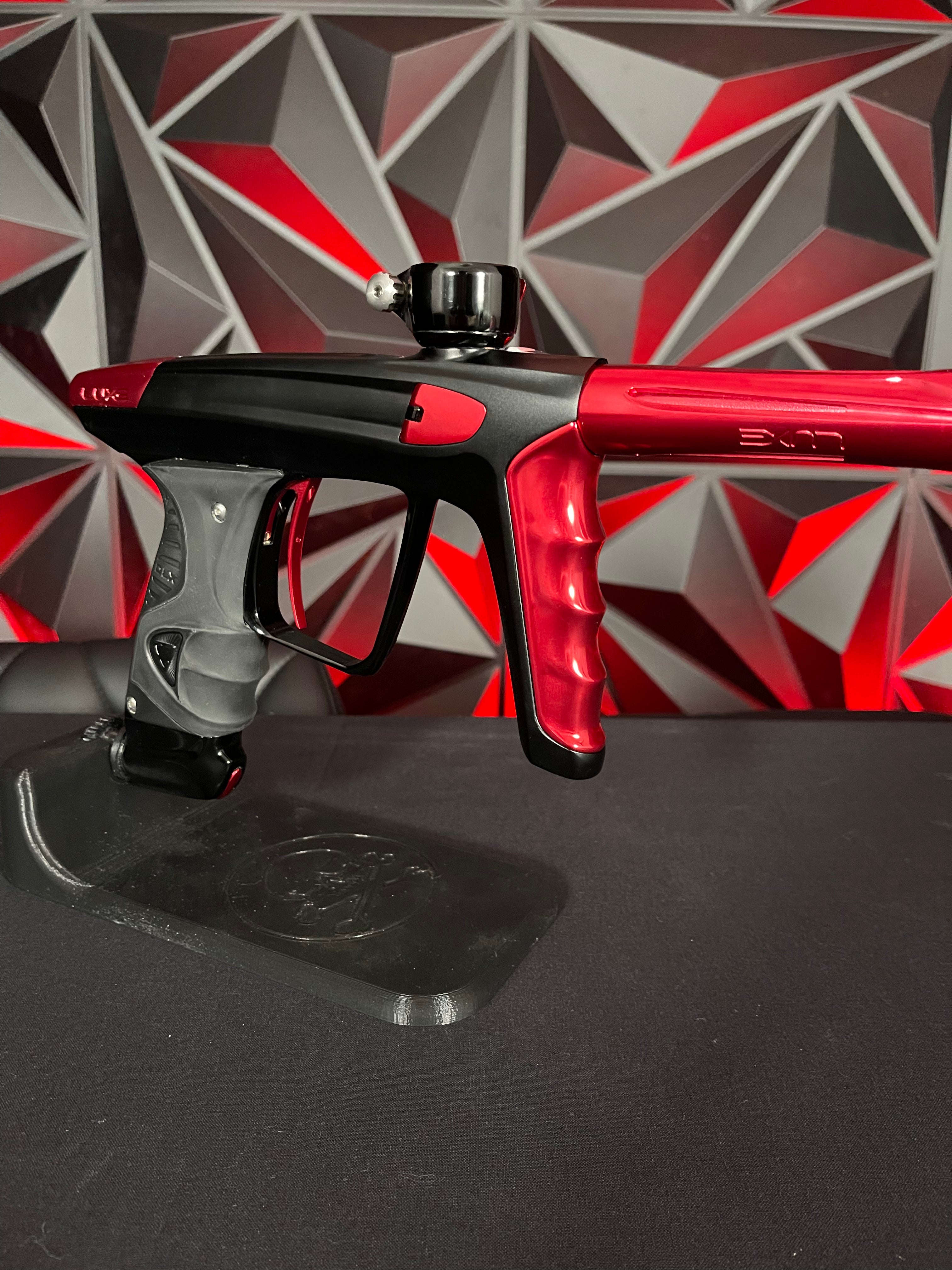 Used DLX Luxe X Paintball Gun - Dust Black Body/Gloss Trigger Frame/Red Accents