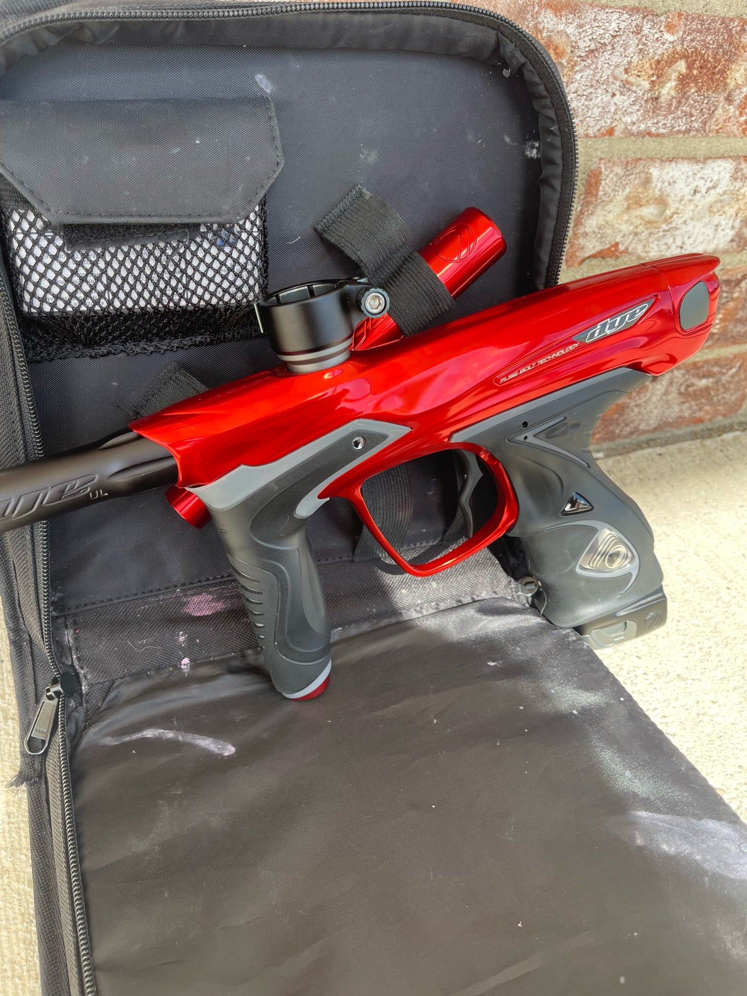 Used Dye DM15 Paintball Marker - Gloss Red w/ 2 UL Backs, Lockdown 2 Feedneck, SLAP ASA, Deuce Trigger