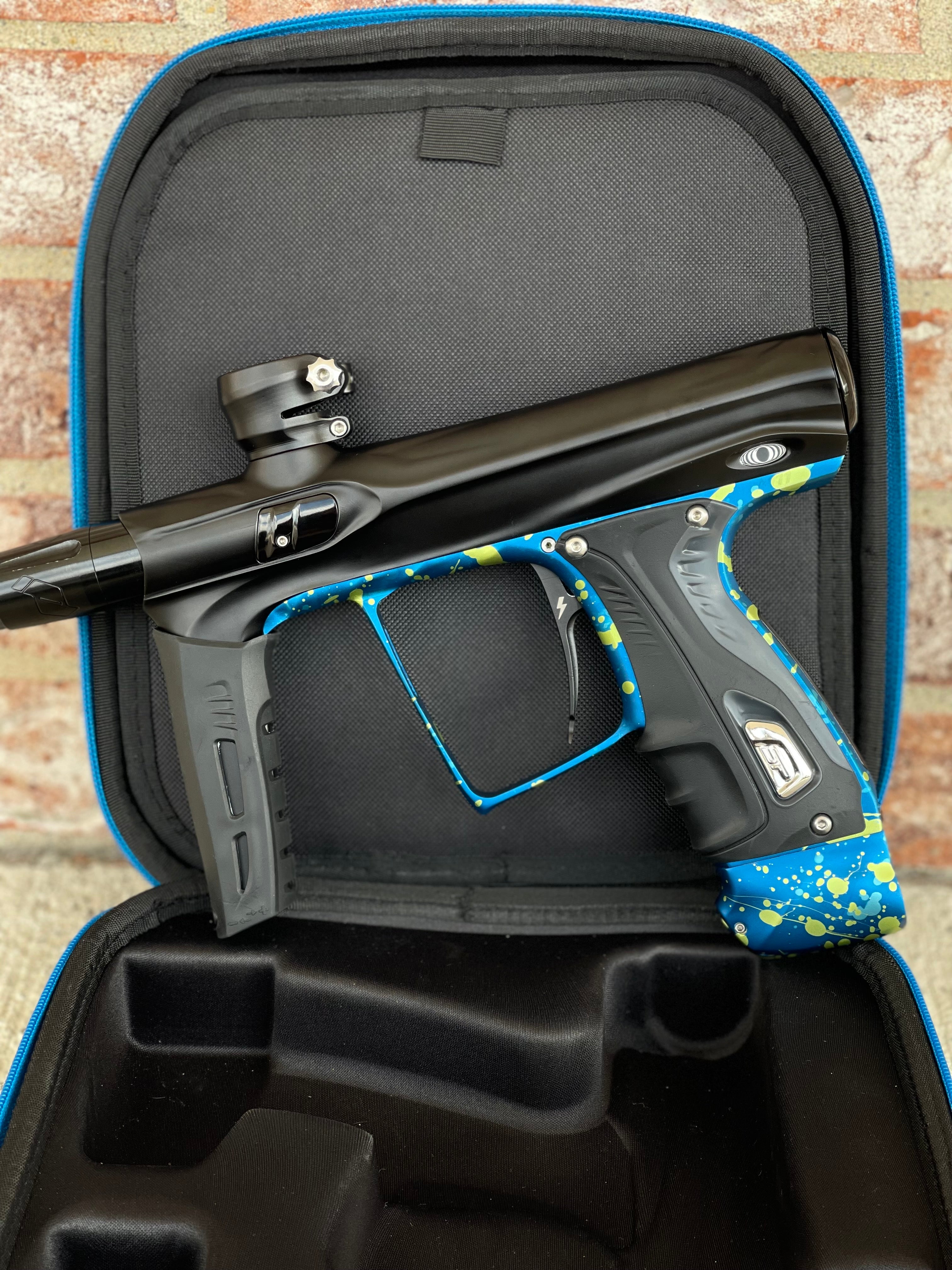 Used Shocker XLS Paintball Gun - Black with Blue Green Splash Trigger Frame and CVO Frame